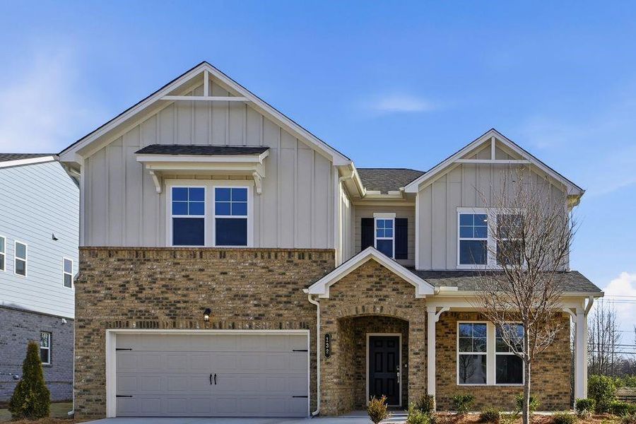 Front exterior of a new home in Bennett Farm, Loganville, GA, highlighting curb appeal (Image 1). Front exterior of a new home in Bennett Farm, Loganville, GA, highlighting curb appeal (Image 1).