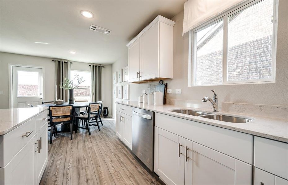 Eat in kitchen features large island *Model representation