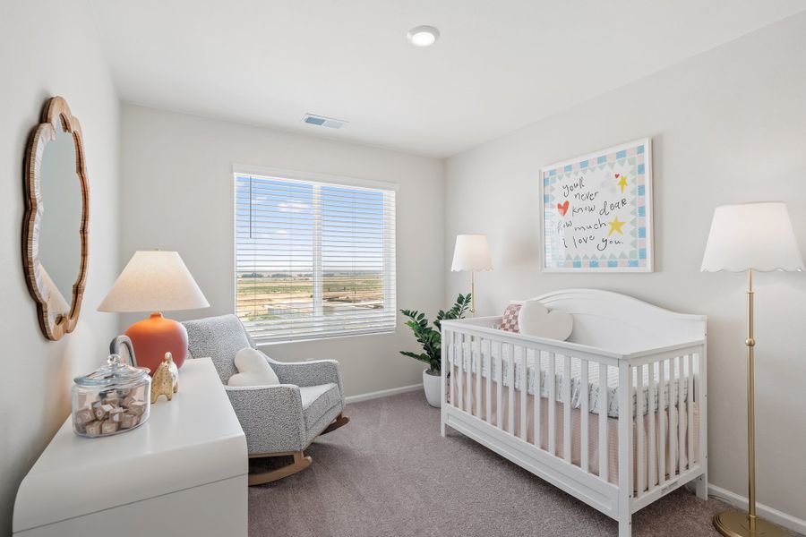 Representative furnished interior of a home built from the 2003 by Risewell Homes in Harvest Crossing, Aurora (Image 10).
