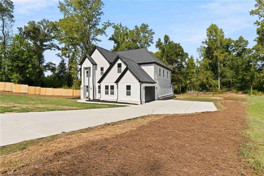 Front exterior of a new home in , Griffin, GA, highlighting curb appeal (Image 25). Front exterior of a new home in , Griffin, GA, highlighting curb appeal (Image 25).