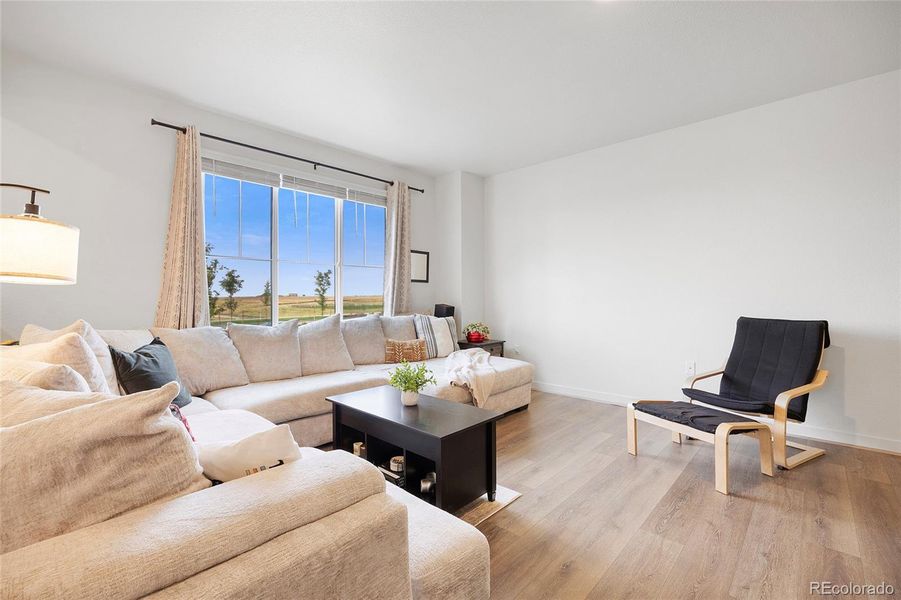 Spacious family room with beautiful LVP floors throughout main level.