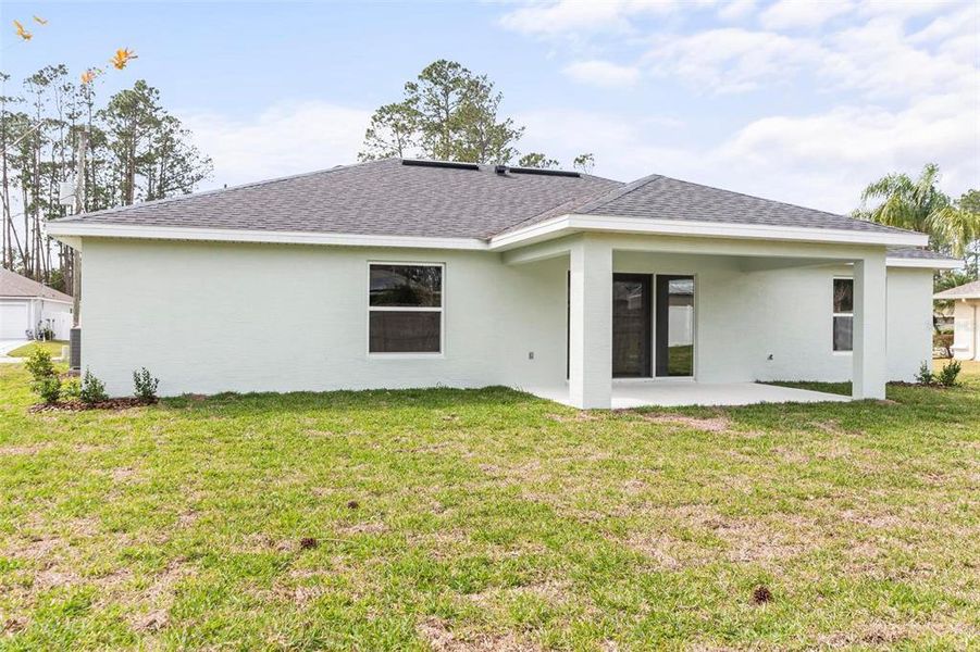 Front exterior of a new home in , Palm Coast, FL, highlighting curb appeal (Image 2).