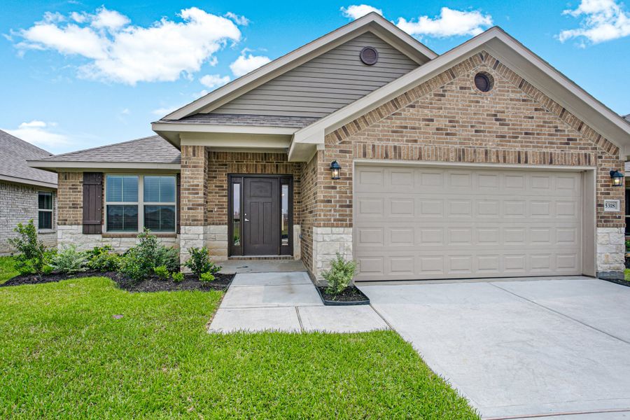 Front exterior of a new home in Bayou Maison, Dickinson, TX, highlighting curb appeal (Image 2).