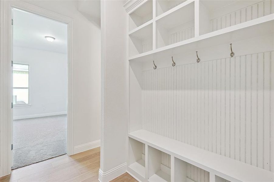 Mudroom with light wood-type flooring