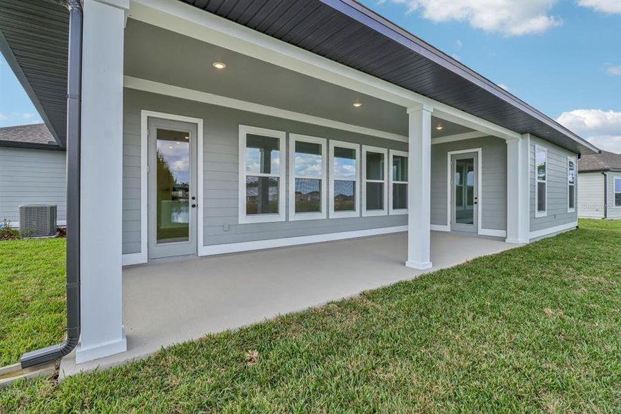 Exterior details and patio area of a home in Ardisia Park Estate, New Smyrna Beach (Image 3).