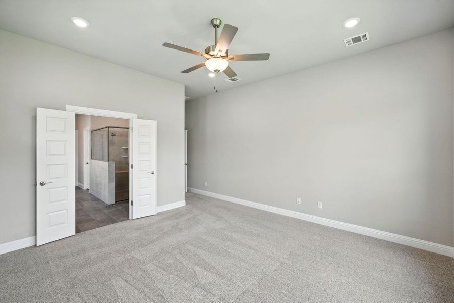 Unfurnished bedroom with carpet flooring, recessed lighting, and ceiling fan Unfurnished bedroom with carpet flooring, recessed lighting, and ceiling fan