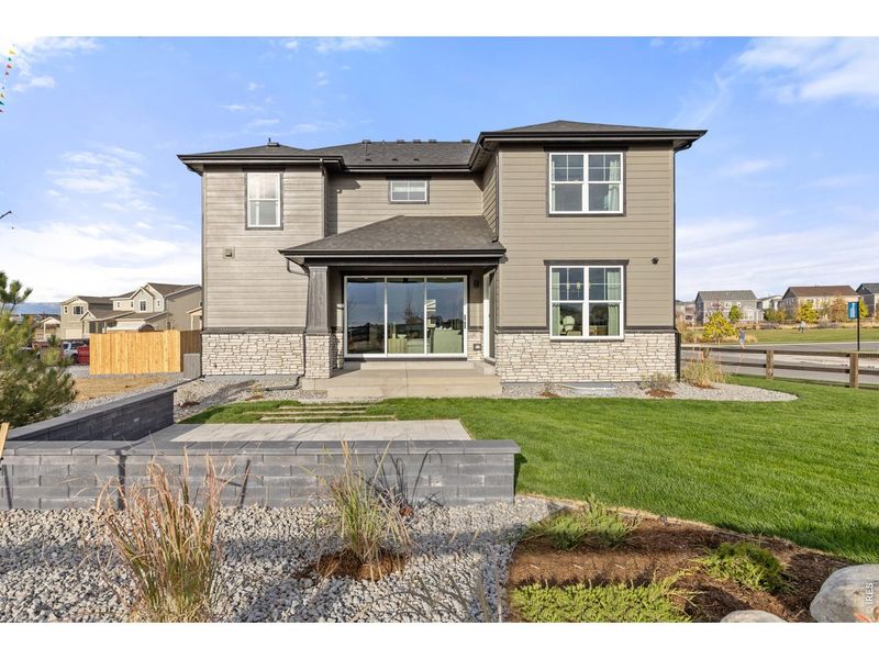 Exterior details and patio area of a home in Barefoot Lakes, Firestone (Image 19).