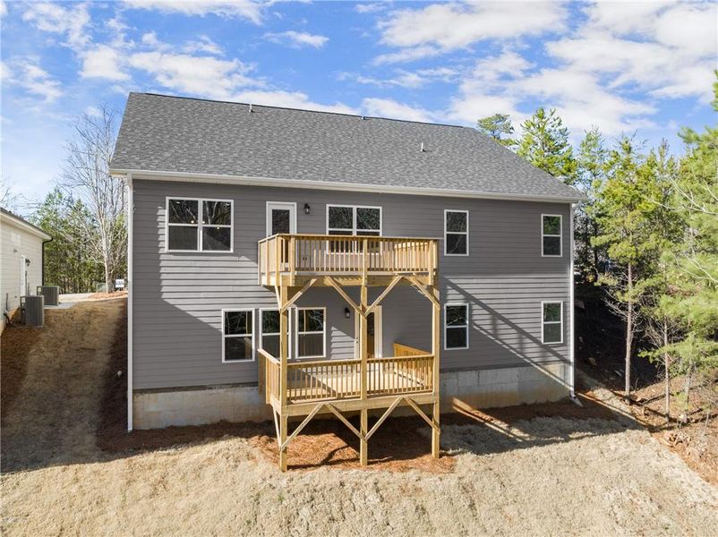 Front exterior of a new home in Magnolia Villas, Cornelia, GA, highlighting curb appeal (Image 1).