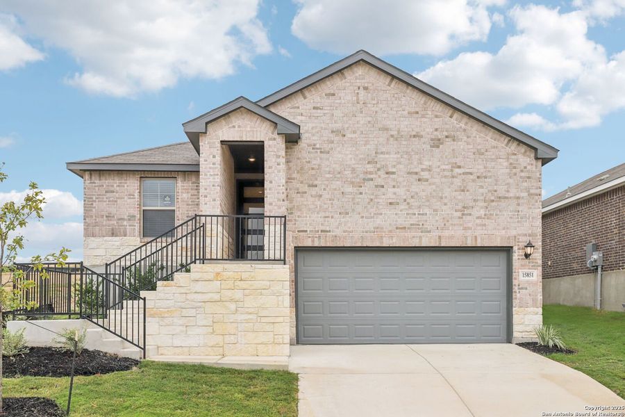 Front exterior of a new home in Comanche Ridge, San Antonio, TX, highlighting curb appeal (Image 1). Front exterior of a new home in Comanche Ridge, San Antonio, TX, highlighting curb appeal (Image 1).