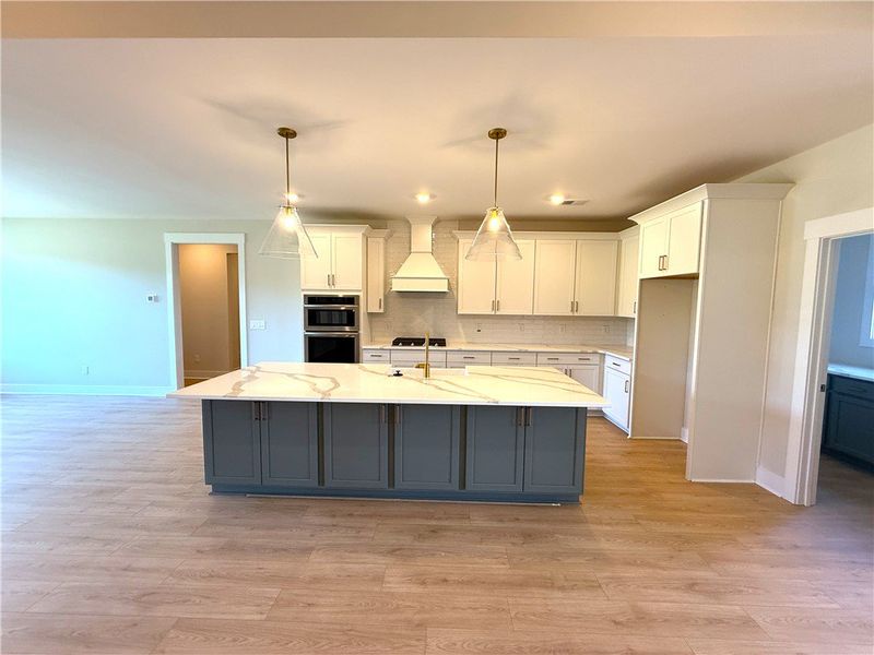 This spacious kitchen offers a large island with a