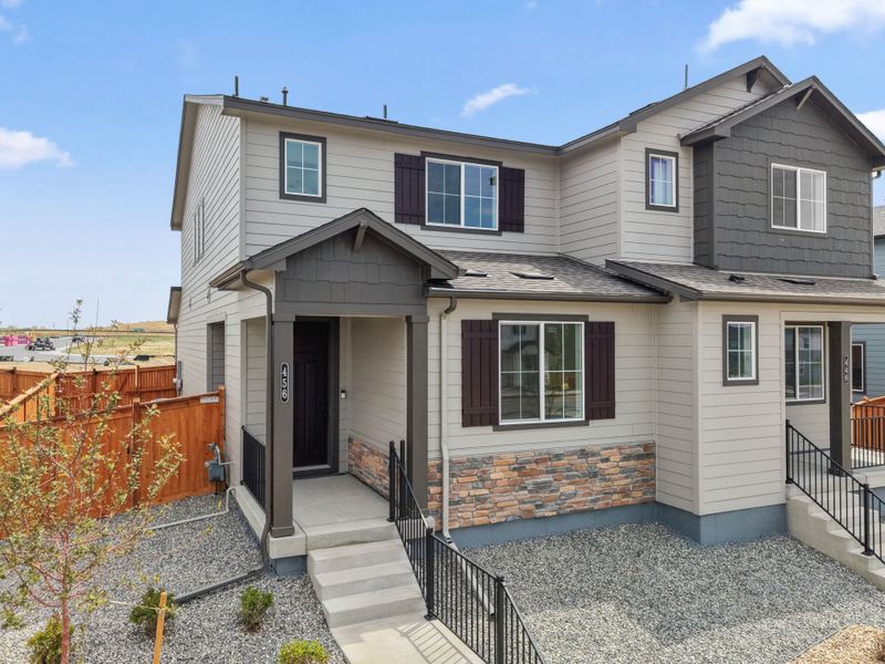 Front exterior of a new home in Sky Ranch, Watkins, CO, highlighting curb appeal (Image 17).