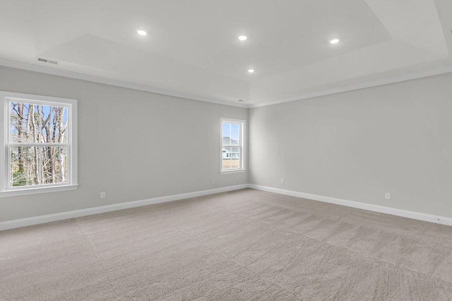 Spacious, unfurnished interior of a new home in Tidewater at Lakes of Cane Bay, Summerville (Image 50).