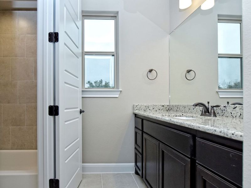 Representative furnished interior of a home built from the Madera II by Giddens Homes in Scofield Farms Estates, Georgetown (Image 265).