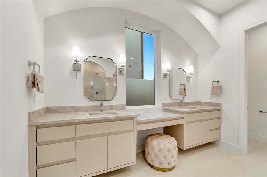 Bathroom featuring double vanity and a walk in shower Bathroom featuring double vanity and a walk in shower