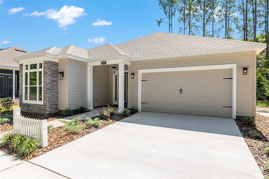 Front exterior of a new home in Fairway Pointe at West End, Newberry, FL, highlighting curb appeal (Image 34). Front exterior of a new home in Fairway Pointe at West End, Newberry, FL, highlighting curb appeal (Image 34).