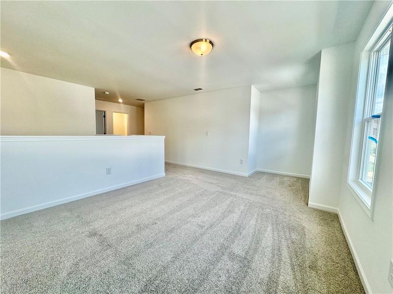 Spacious, unfurnished interior of a new home in Eastlyn Crossing, Flowery Branch (Image 32).