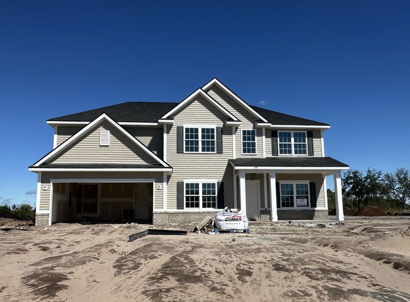 Front exterior of a new home in Tibet Road at Sassafras, Allenhurst, GA, highlighting curb appeal (Image 1).