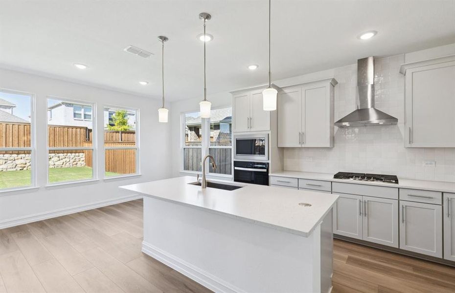 Spacious kitchen with eat-in bartop island