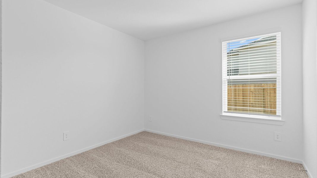 Spacious, unfurnished interior of a new home in Caldwell Crossing, Iowa Colony (Image 19).