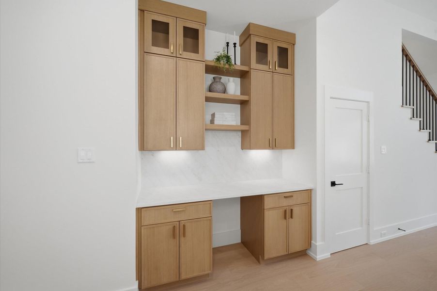 Entertaining bar and storage adjacent to the kitchen.