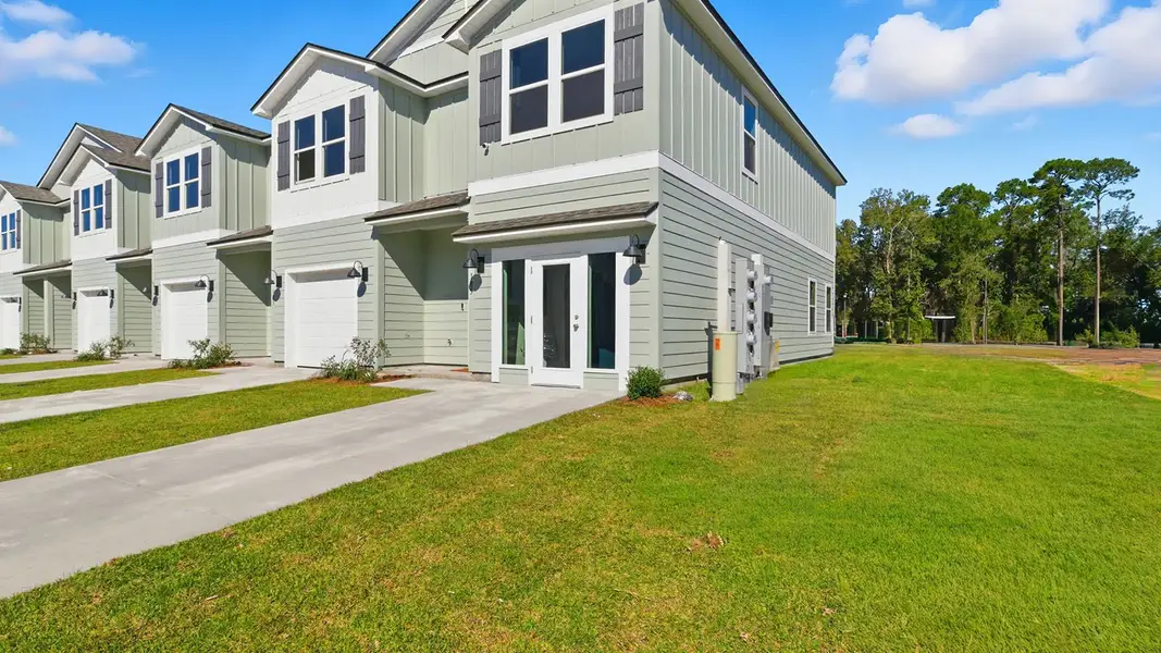 Front exterior of a new home in Revelry, Tallahassee, FL, highlighting curb appeal (Image 2). Front exterior of a new home in Revelry, Tallahassee, FL, highlighting curb appeal (Image 2).