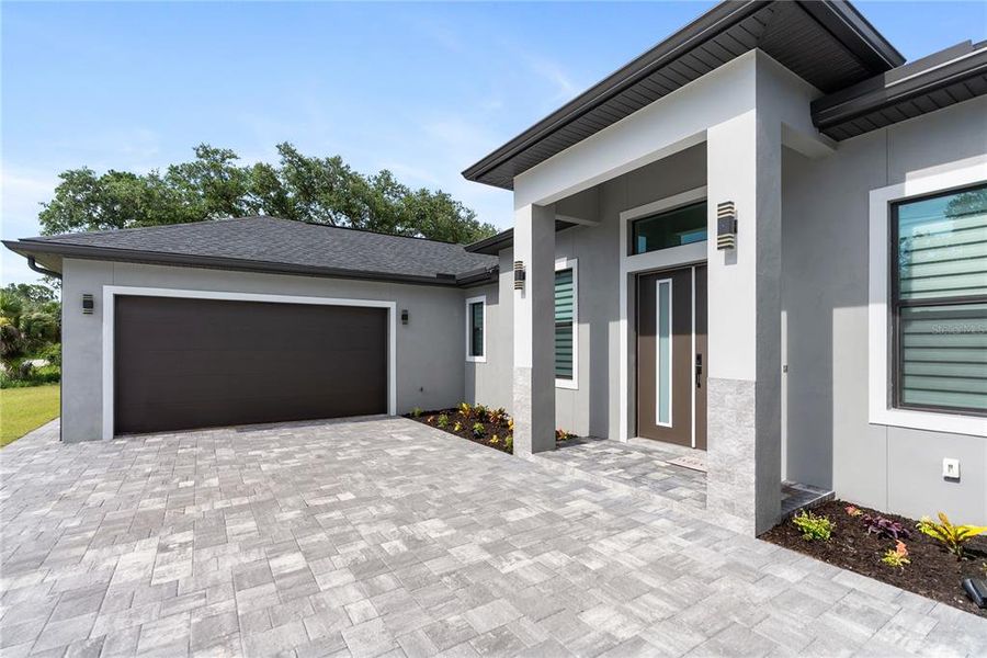 Front exterior of a new home in , Port Charlotte, FL, highlighting curb appeal (Image 2). Front exterior of a new home in , Port Charlotte, FL, highlighting curb appeal (Image 2).