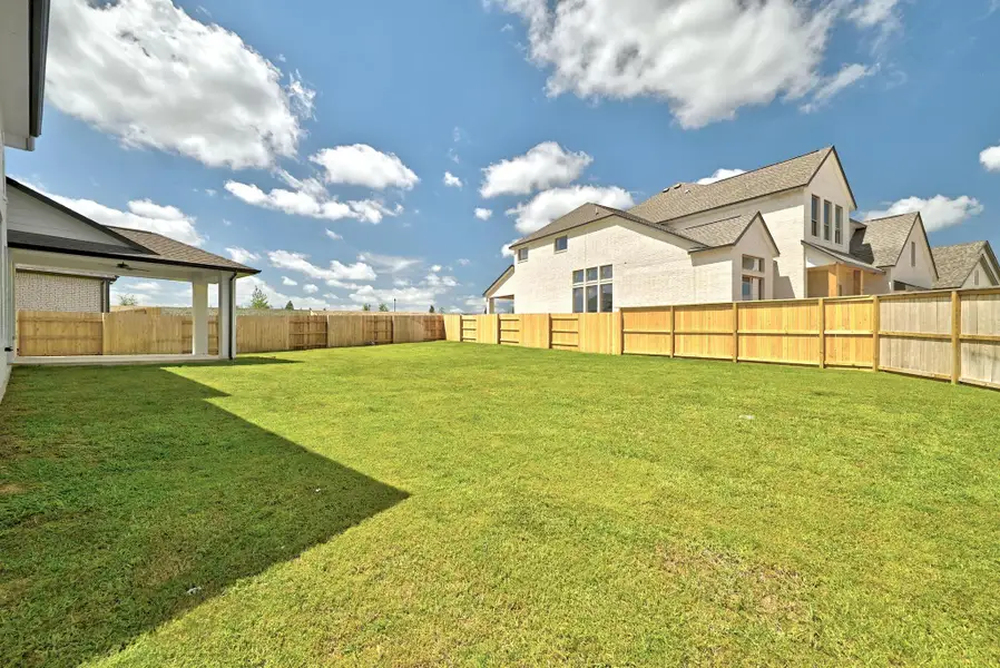 Front exterior of a new home in Flora - 60', Hutto, TX, highlighting curb appeal (Image 1).