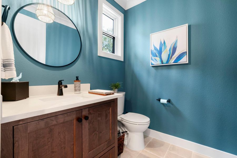 Powder room located off the kitchen. Powder room located off the kitchen.