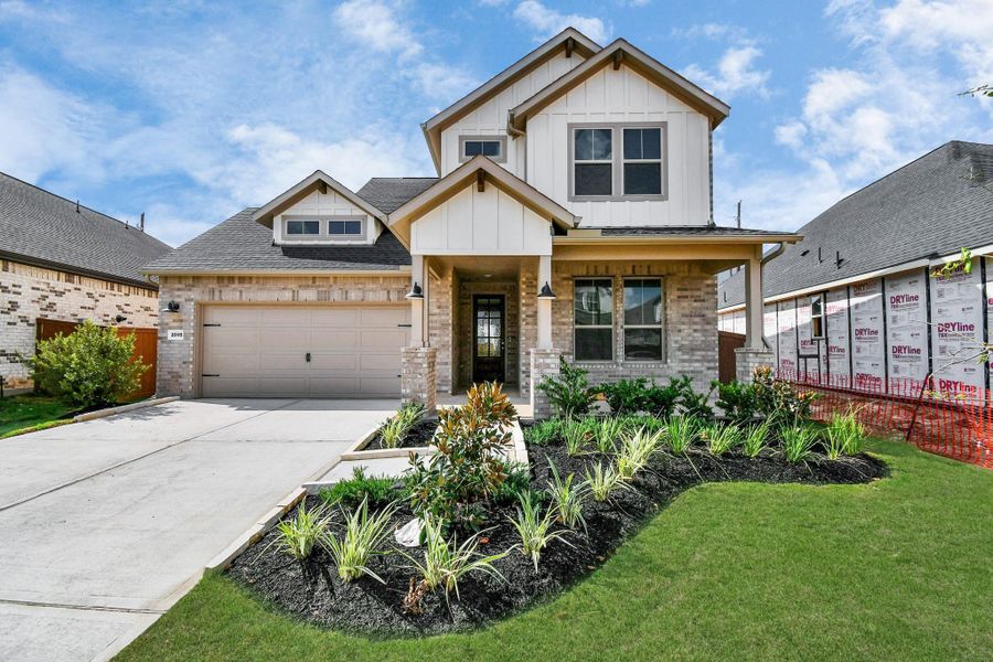 Front exterior of a new home in Elyson, Katy, TX, highlighting curb appeal (Image 1). Front exterior of a new home in Elyson, Katy, TX, highlighting curb appeal (Image 1).