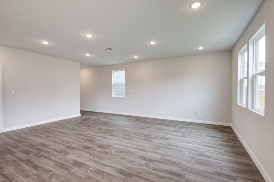 A room with a wood floor and a wood floor. A room with a wood floor and a wood floor.