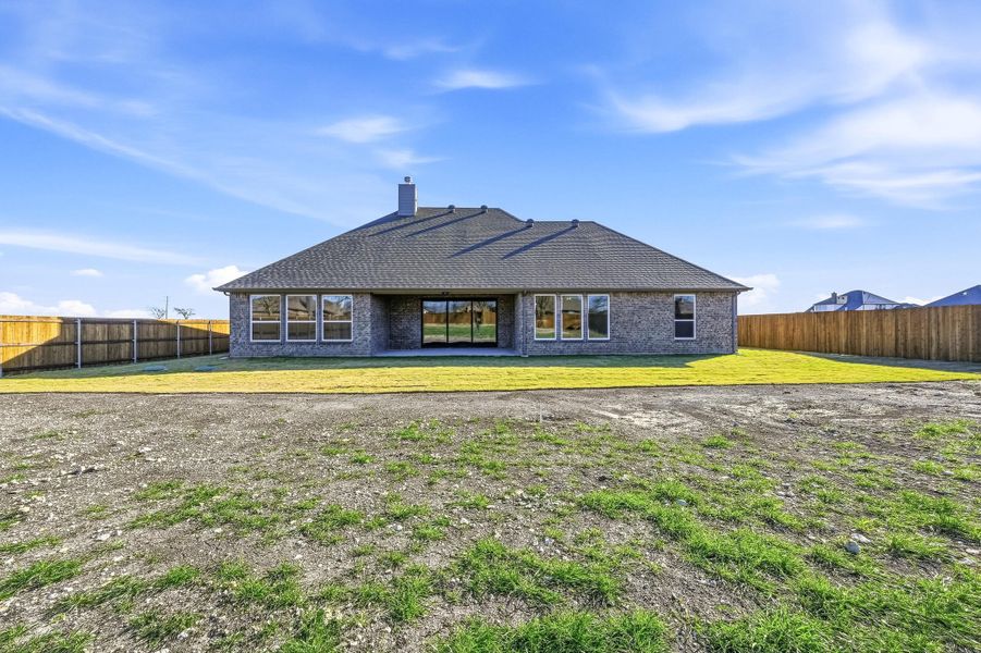 Front exterior of a new home in Coyote Crossing, Godley, TX, highlighting curb appeal (Image 24).