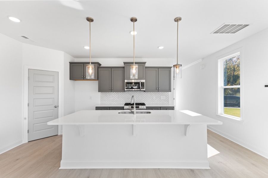 Representative furnished interior of a home built from the The Hemlock by RobuckHomes in Kennebec Crossing, Angier (Image 18).
