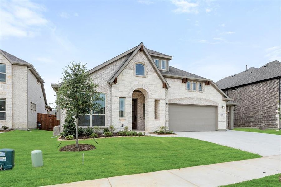 Front exterior of a new home in Glenwood Meadows, Argyle, TX, highlighting curb appeal (Image 2). Front exterior of a new home in Glenwood Meadows, Argyle, TX, highlighting curb appeal (Image 2).