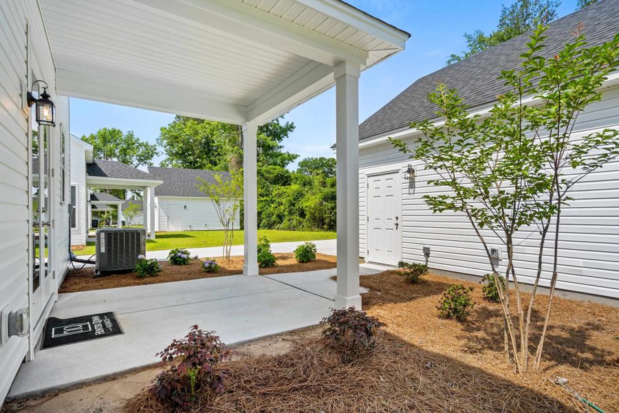 Exterior details and patio area of a home in Downtown Loris Homes, Loris (Image 30).