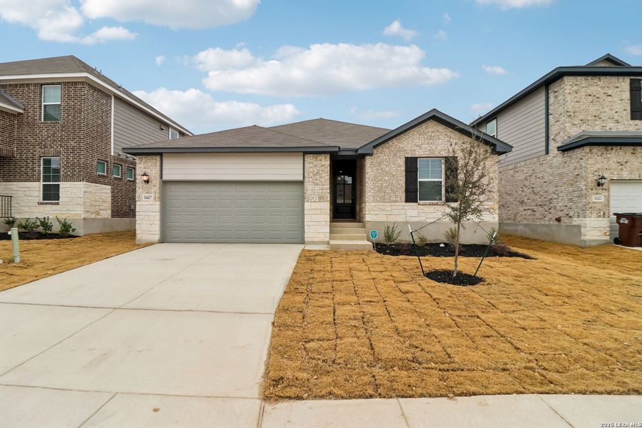 Front exterior of a new home in Sagebrooke - Classic Series, San Antonio, TX, highlighting curb appeal (Image 24).