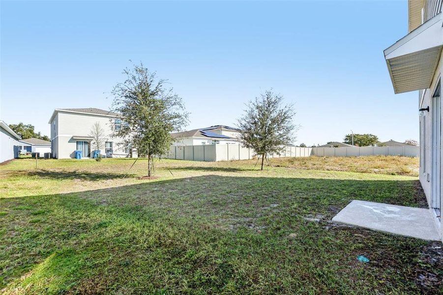 Exterior details and patio area of a home in The Reserve at Bradbury Creek, Haines City (Image 9).