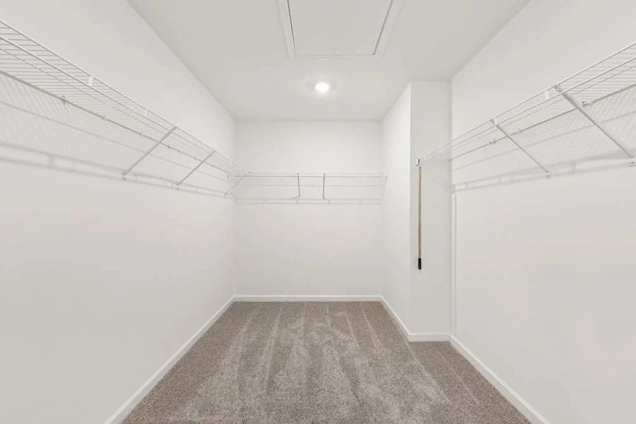 Primary Bedroom Walk-In Closet Primary Bedroom Walk-In Closet