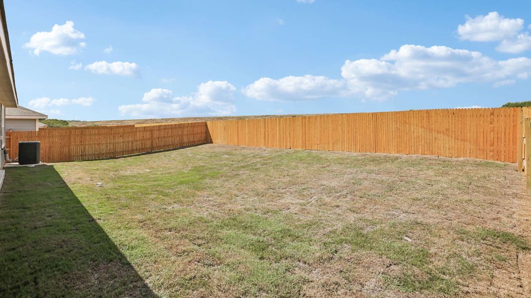 Exterior details and patio area of a home in Prairie Lakes, Buda (Image 4).