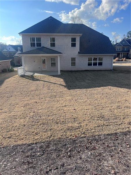 Exterior details and patio area of a home in Mirror Lake at South Harbour, Villa Rica (Image 4).