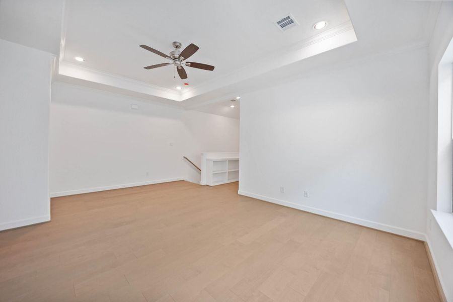 The upstairs game room delivers both size and style with crown molding, LED recessed lighting, and space to spread out.