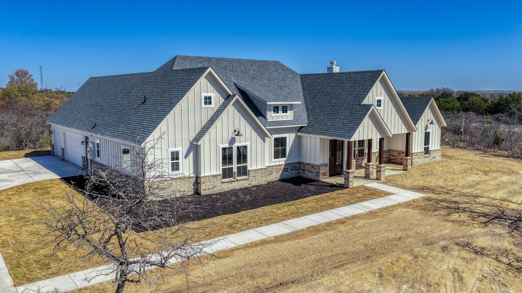 Representative exterior photo of a completed home built from the Rebekah by Zeal Home Builders in Oak Water Ranch, Granbury, TX (Image 2). Representative exterior photo of a completed home built from the Rebekah by Zeal Home Builders in Oak Water Ranch, Granbury, TX (Image 2).