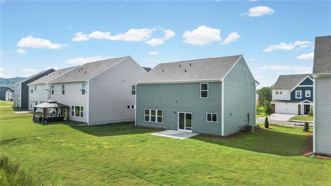 Exterior details and patio area of a home in Twin Lakes, Hoschton (Image 24).