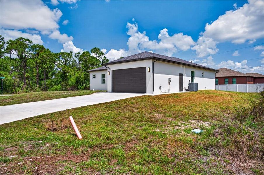 Front exterior of a new home in , Port Charlotte, FL, highlighting curb appeal (Image 28). Front exterior of a new home in , Port Charlotte, FL, highlighting curb appeal (Image 28).