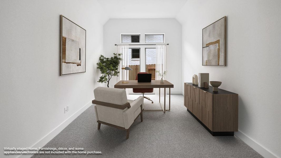 Office with baseboards, carpet floors, and vaulted ceiling Office with baseboards, carpet floors, and vaulted ceiling