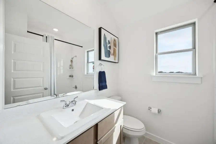Bathroom in the Diamond home plan by Trophy Signature Homes – REPRESENTATIVE PHOTO
