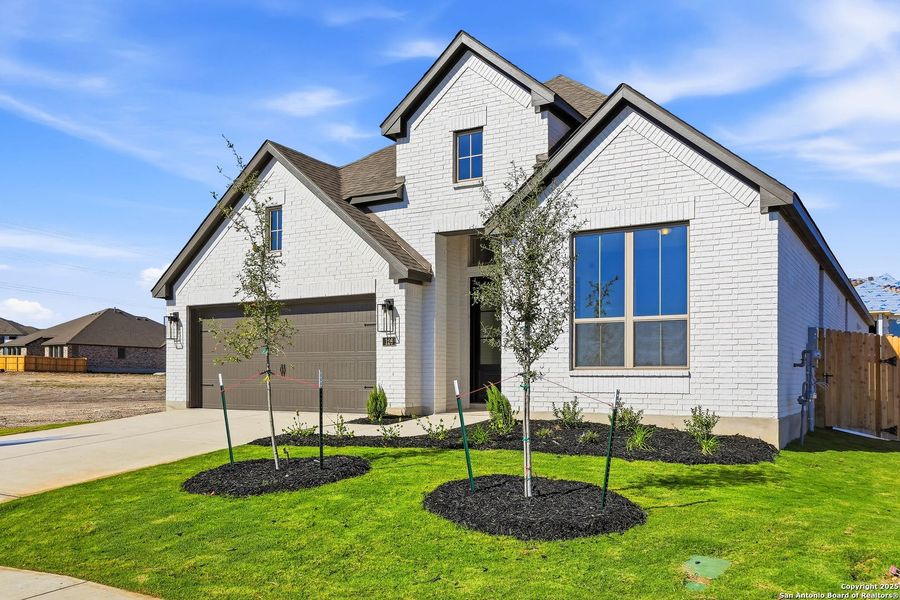 Front exterior of a new home in Haby Hill 50s, San Antonio, TX, highlighting curb appeal (Image 1). Front exterior of a new home in Haby Hill 50s, San Antonio, TX, highlighting curb appeal (Image 1).