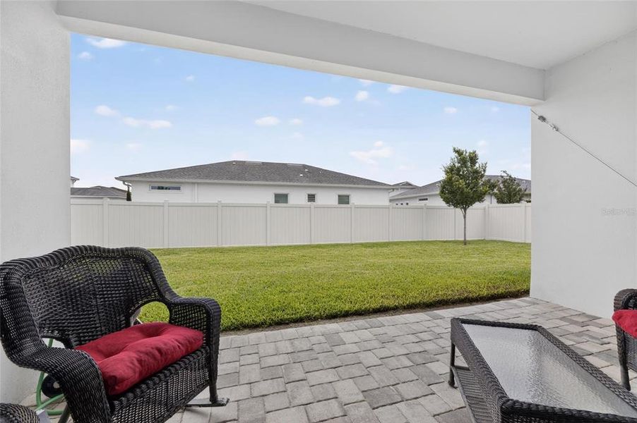 Exterior details and patio area of a home in Robin's Cove at Epperson, Wesley Chapel (Image 3).