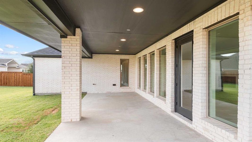 Exterior details and patio area of a home in Terraces 72', Rockwall (Image 3).