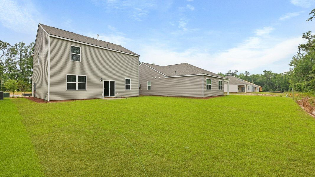 Front exterior of a new home in Pineview North, Summerville, SC, highlighting curb appeal (Image 2).