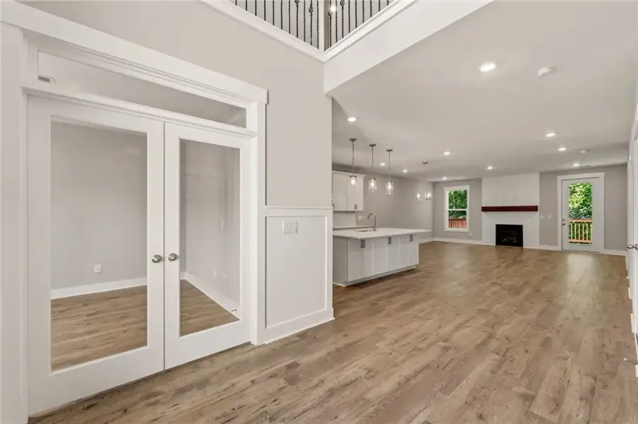 A spacious living area with warm wood-look floorin A spacious living area with warm wood-look floorin